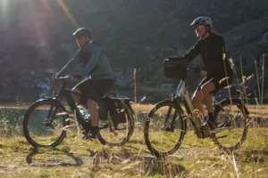 two cyclists on electric bikes