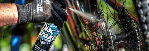 applying disc brake cleaner